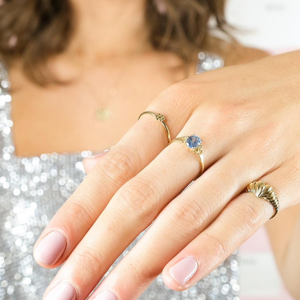 Our MiJu model is wearing multiple solid gold rings together. 