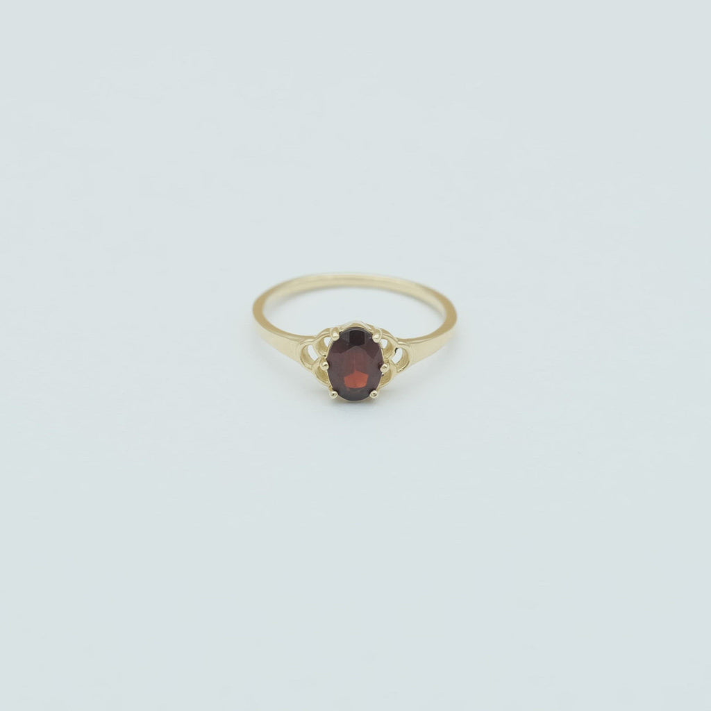 The solid gold mermaid garnet ring in 360 view.