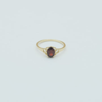 The solid gold mermaid garnet ring in 360 view.