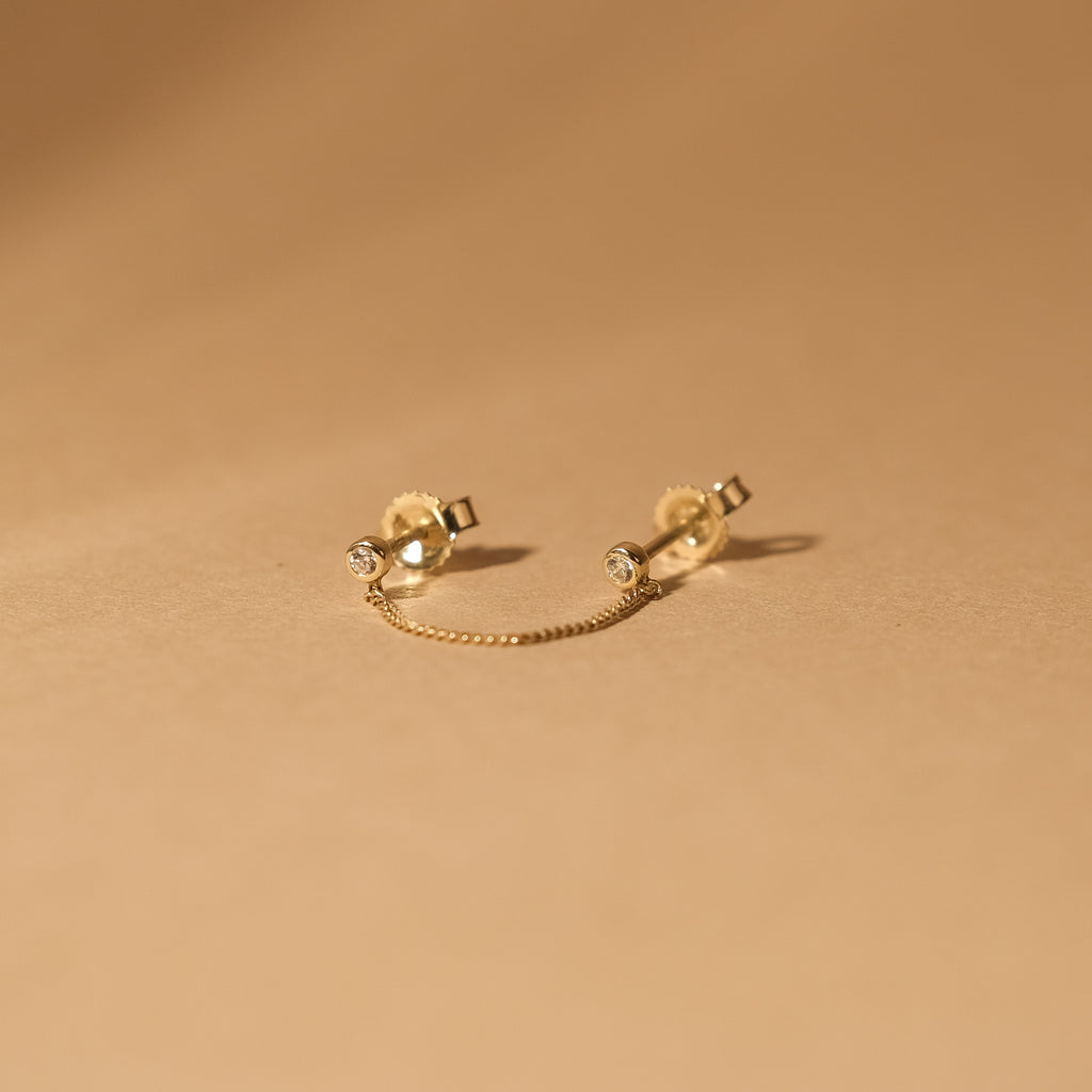 The MiJu Official solid gold vintage chain stud with two small cubic zirconia gemstones.