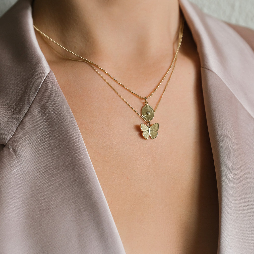 MiJu Official solid gold necklace layering with the butterfly and vintage diamond coin pendants.