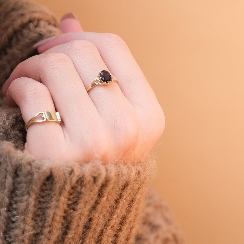 Wearing the solid gold mermaid garnet ring combined with the vintage heart pinky ring.